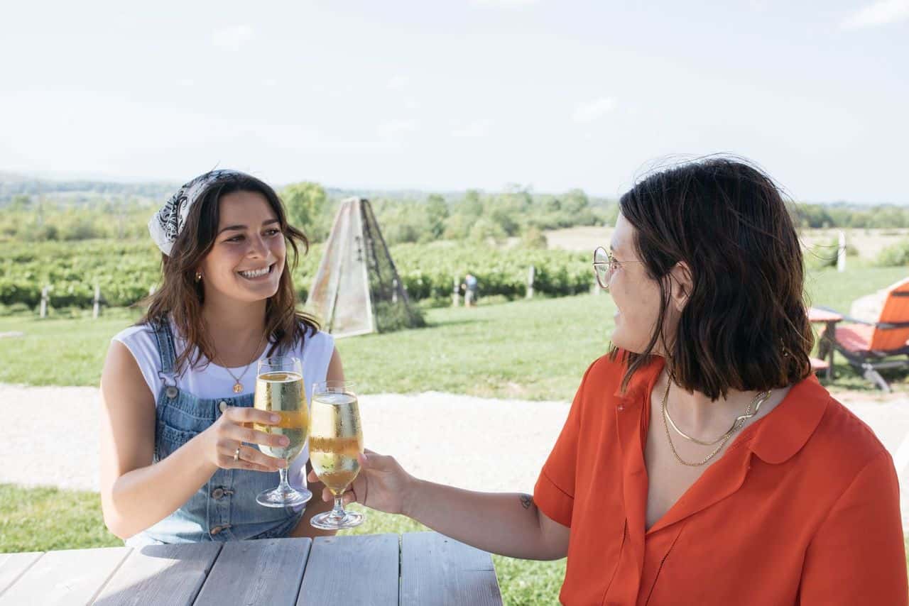 A photo of two women drinking cider at Spy Cidery.