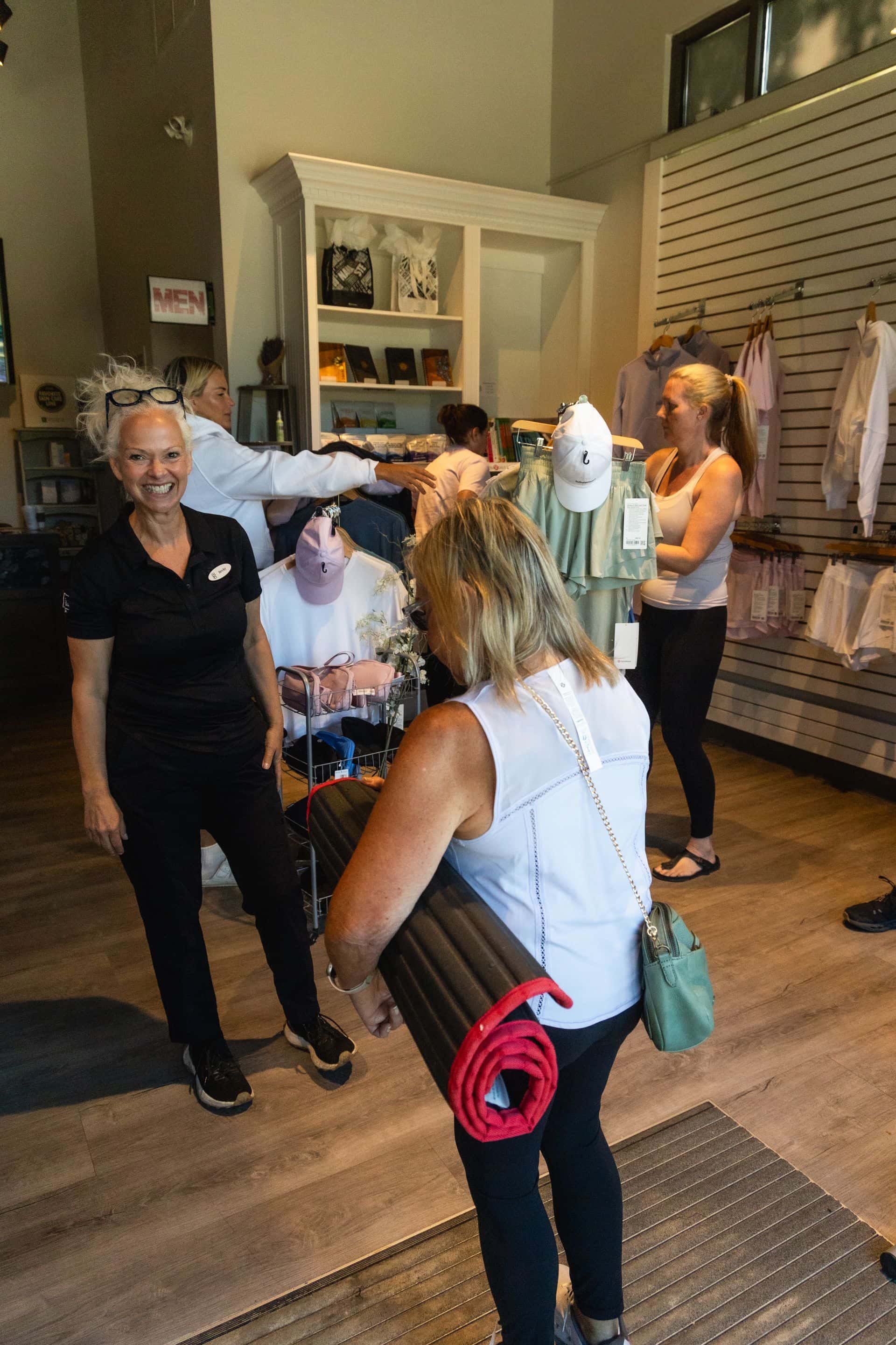 Women shopping through LuluLemon finds at iwa Spa Boutique in Blue Mountain Village