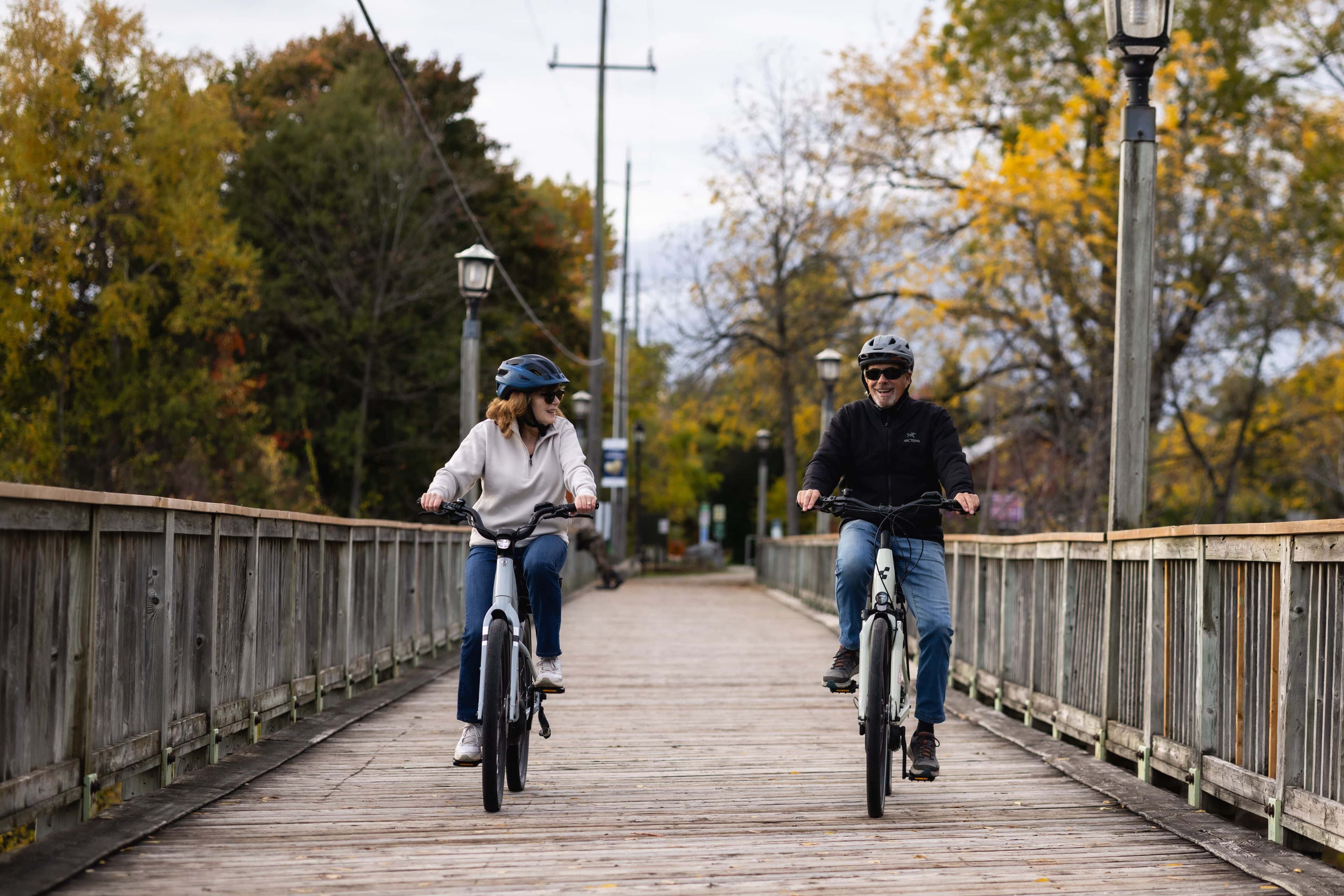 A mature couple exploring the Apple Pie Trail by riding along the Bruce Trail on e-bikes