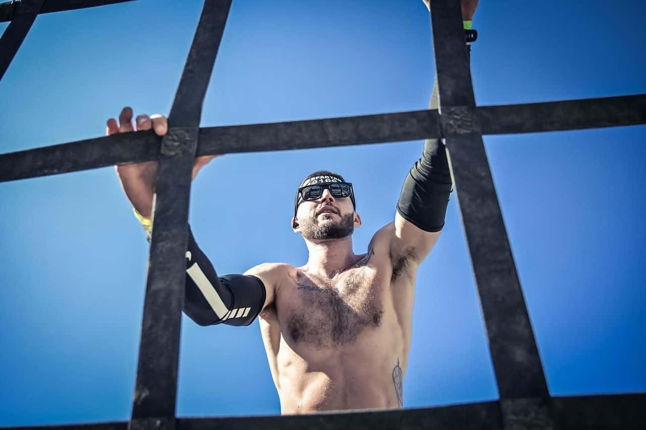 A Man climbing up the giant pyramid feature in the Village Events Plaza during Spartan Trifecta's Obstacle Course at Blue Mountain.