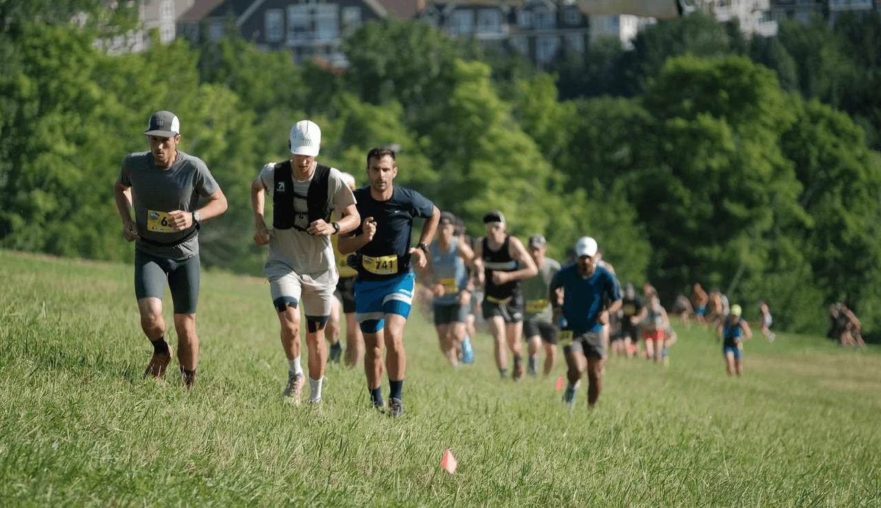 Racers running up the Blue Mountain Resort trails for the Blue Bully Ultra by Sinister Sports