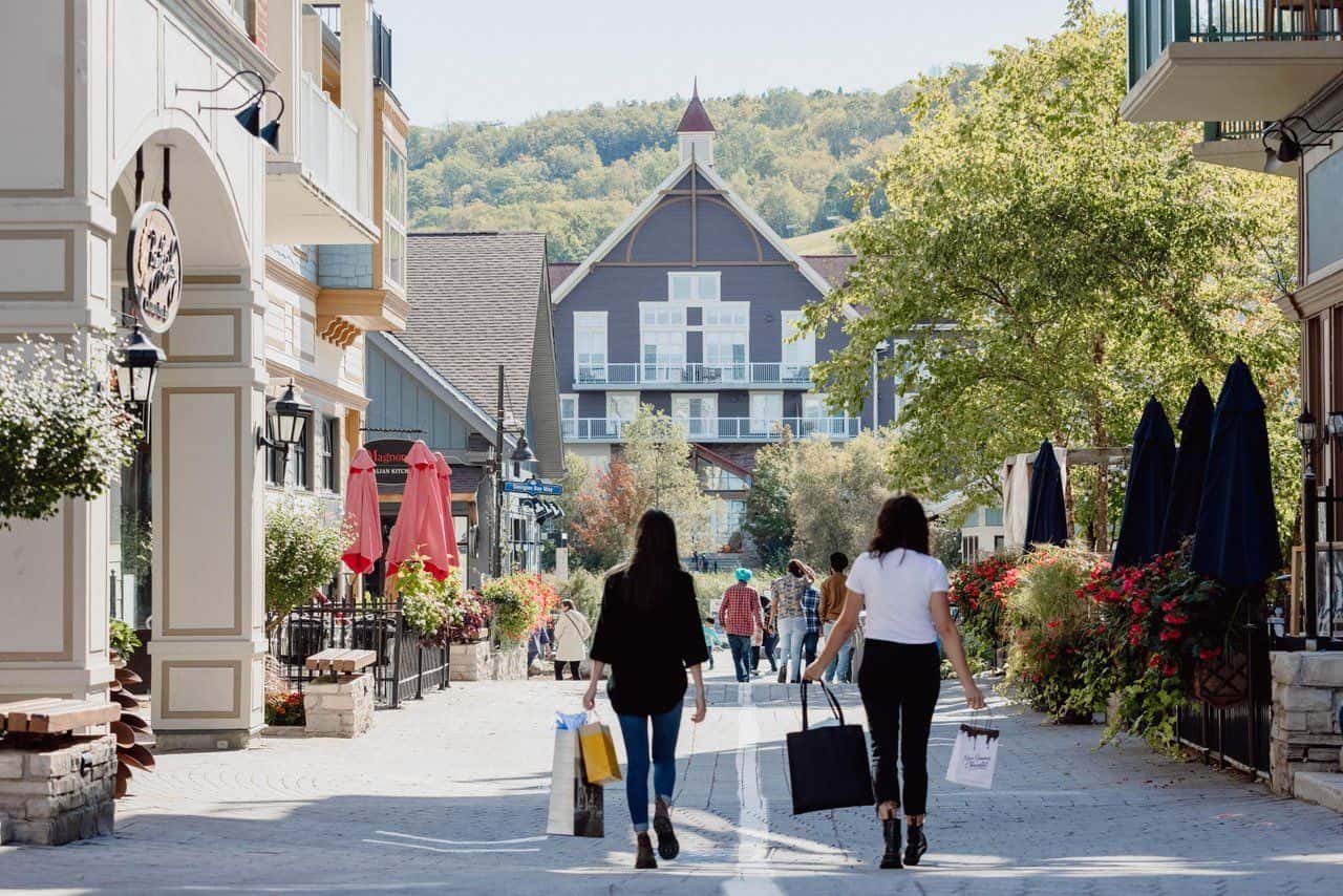 Two ladies shopping in the streets of Blue Mountain Village.