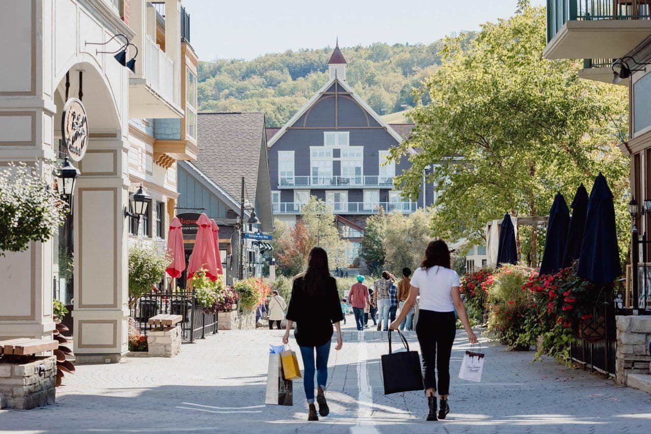 Two ladies shopping in the streets of Blue Mountain Village.