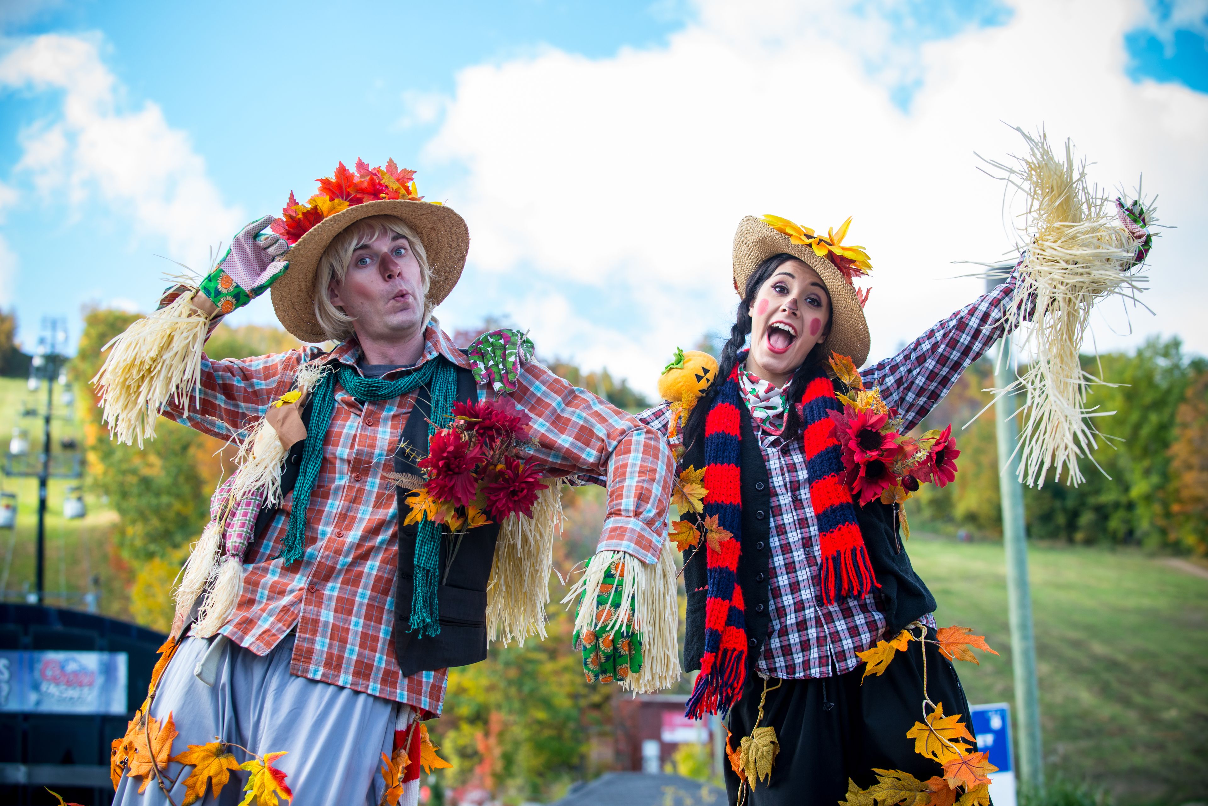 Two animated characters pose for a photo at Apple Harvest Weekend.  