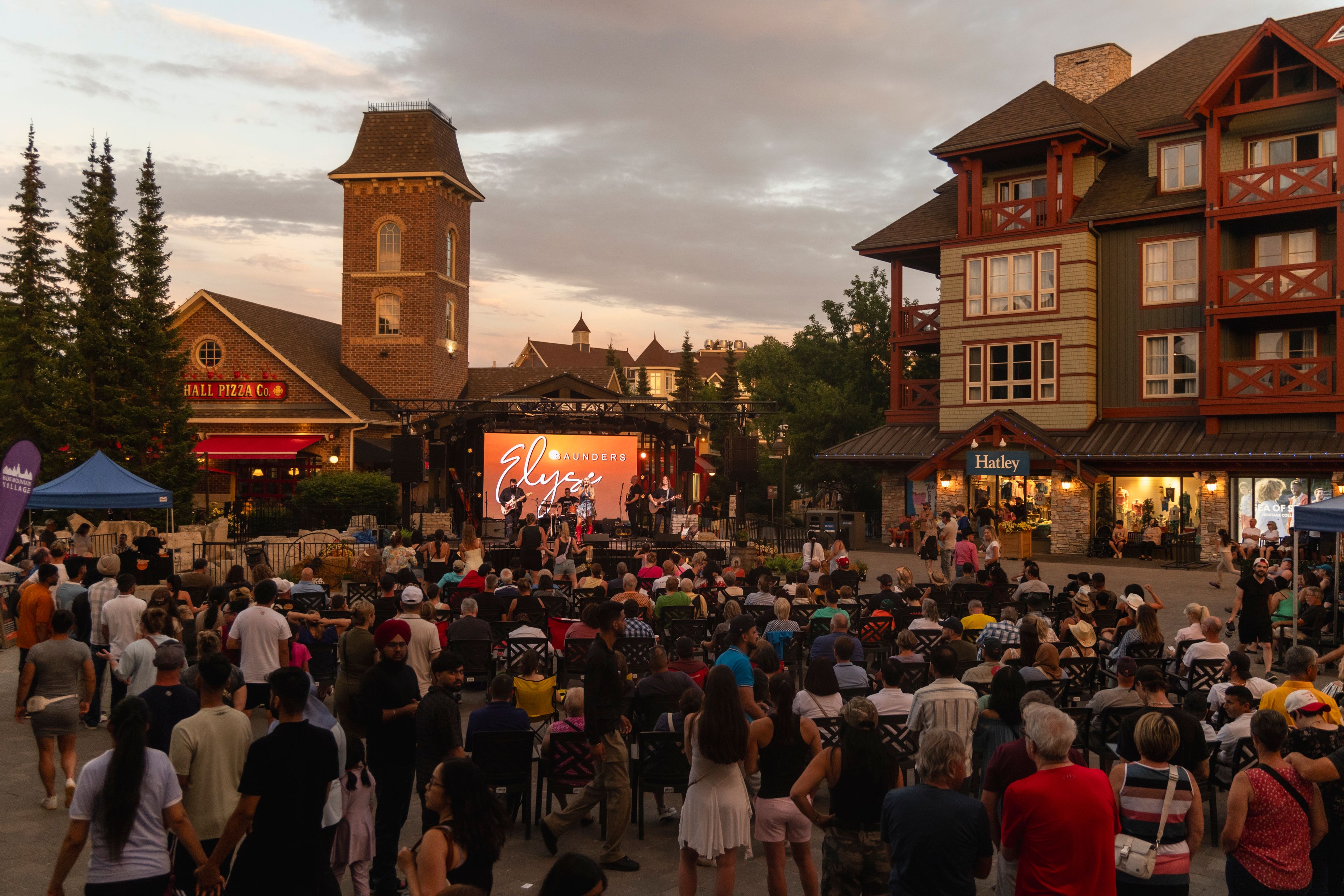 Canadian Country music artist, Elyse Saunders, performing live on the Subaru Stage to a full audience in the Village Events Plaza during Gone Country Music Festival